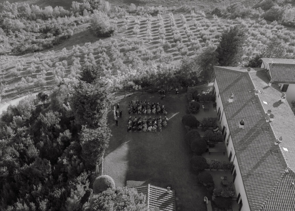 black and white drone photo of wedding ceremony in tuscany.