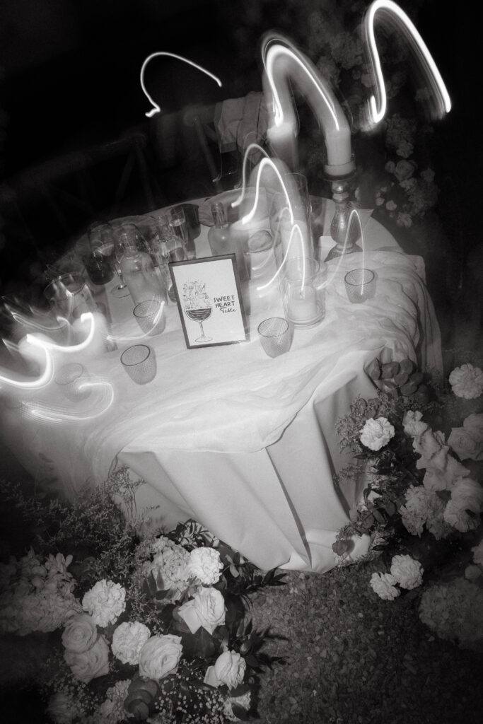 black and white photo of sweetheart table