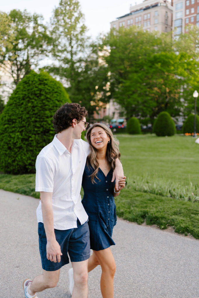Man walking with woman in the Boston Common park taken by Clay Taylor Photo