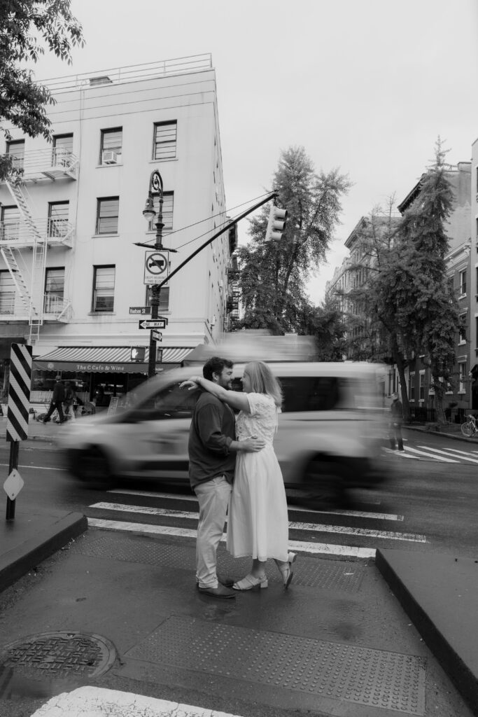 Motion blur New York City engagement portraits in the West Village crosswalk. Photo by Clay Taylor Photo