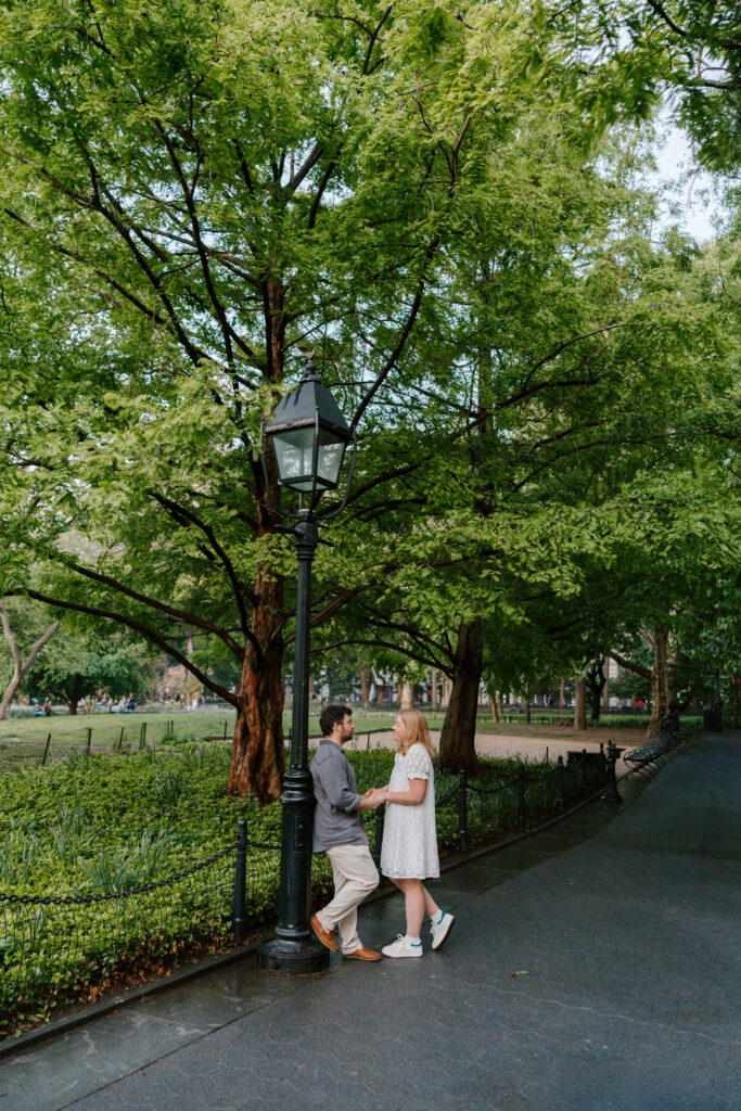 Romantic engagement portraits in Washington Square Park during NYC engagement session. Photo by Clay Taylor Photo