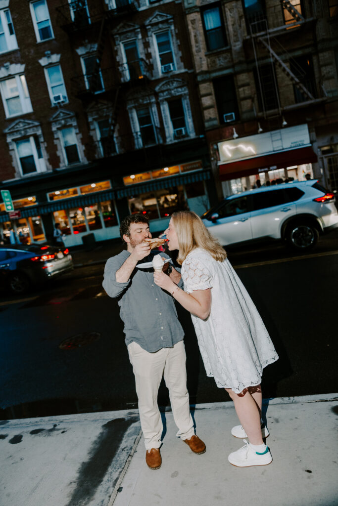 Fun NYC engagement portraits with pizza and ice cream after rainy West Village session. Photo by Clay Taylor Photo