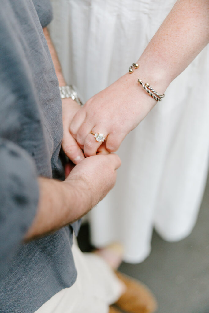 Close up engagement ring photo during rainy New York City engagement session in the West Village. Photo by Clay Taylor Photo