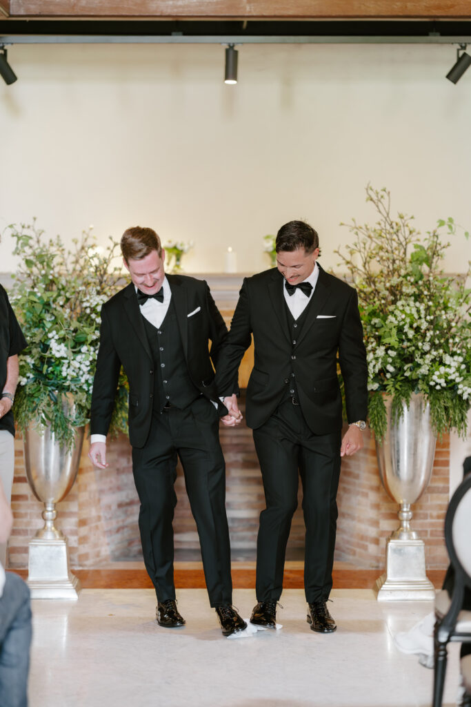 Ryan and Spencer breaking the glass during their Jewish wedding ceremony at the Boston Public Library.