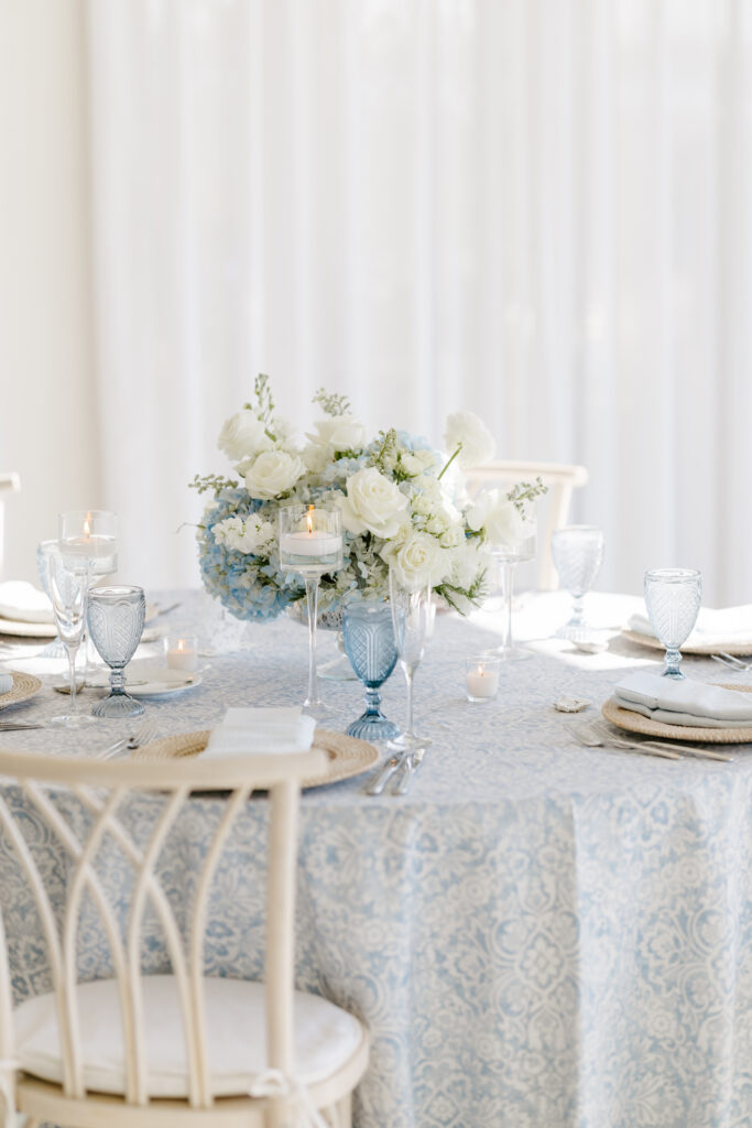 Detail photo of floral arrangement on table at wedding reception at Belle Mer