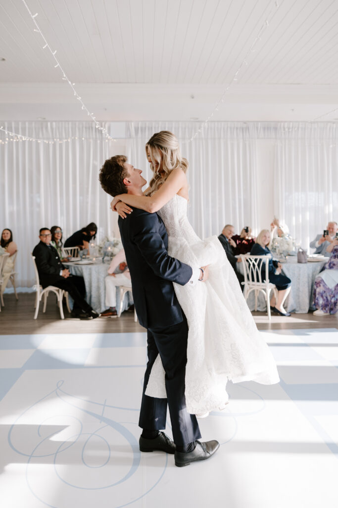 Groom lifts bride during first dance at Rhode Island wedding