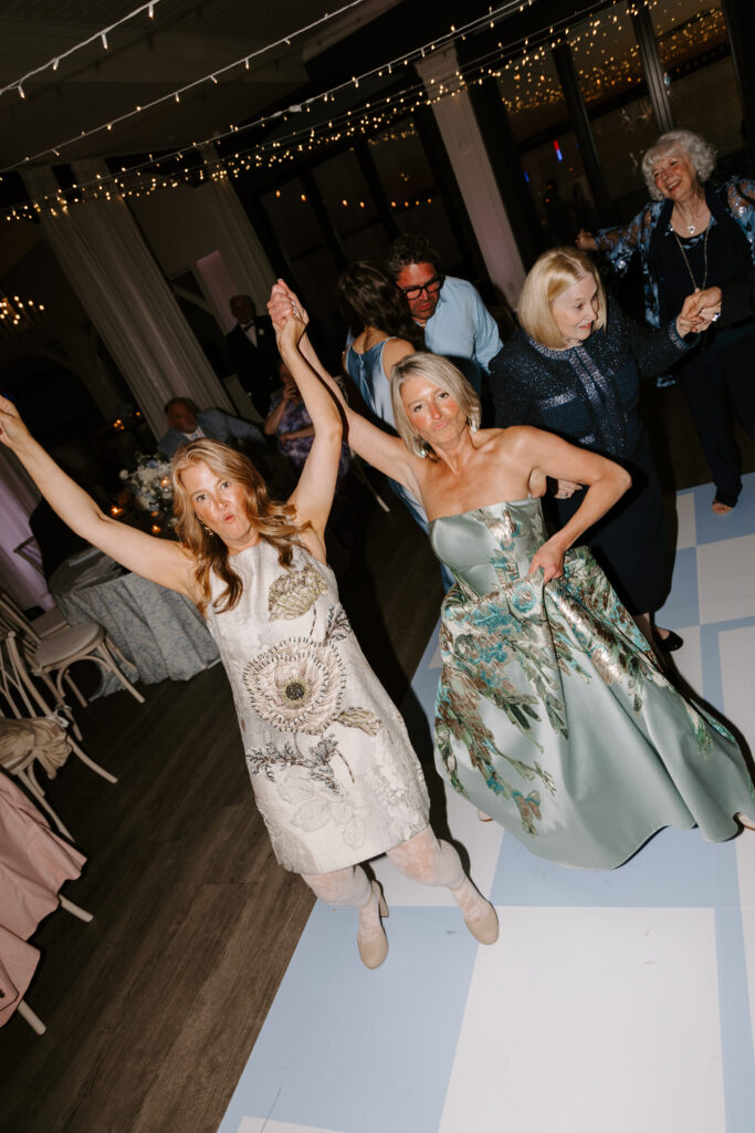 Guests dance at wedding reception at Belle Mer