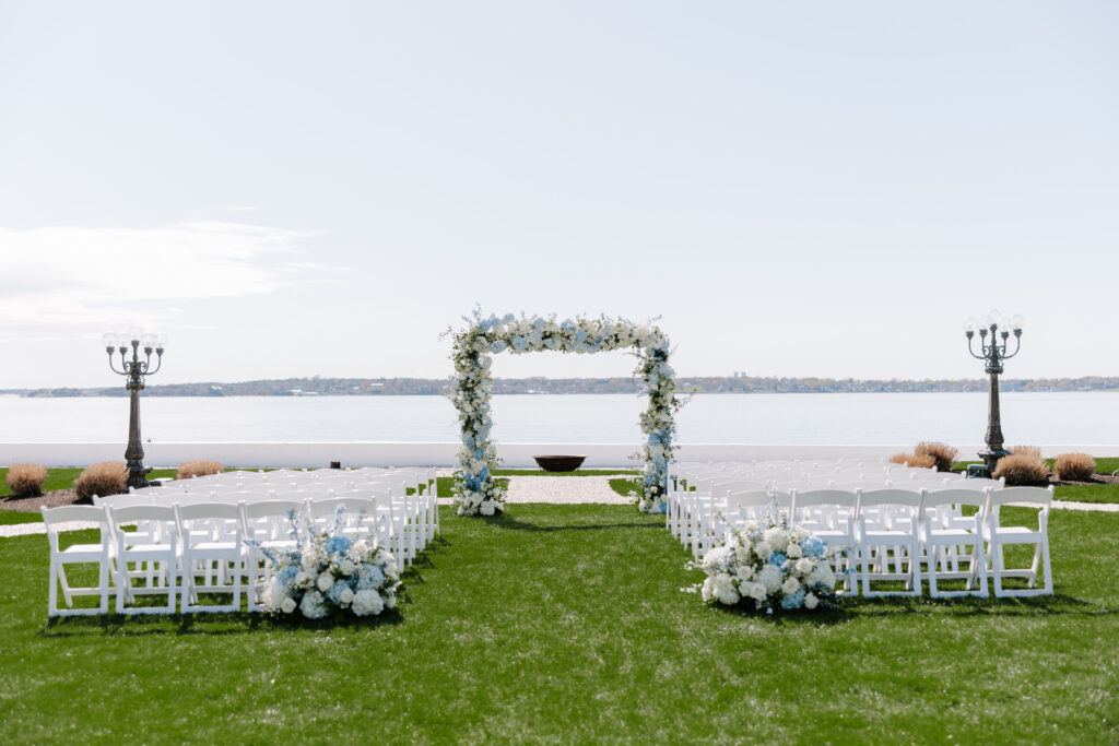Detail photo of ceremony at Belle Mer with beautiful blue hydrangea arbor