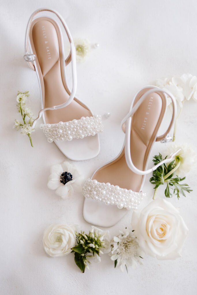 Bridal shoes detail photo flat lay with floral