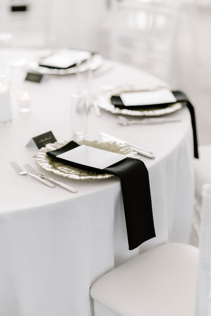 Detail photo of reception tables with black and white color pallet