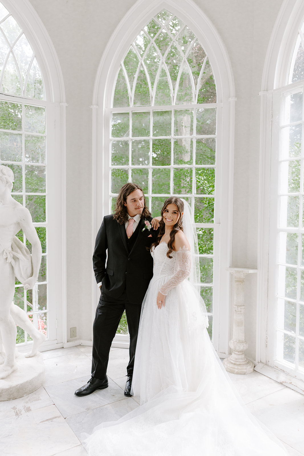 Bride and groom portrait inside conservatory at Linden Place