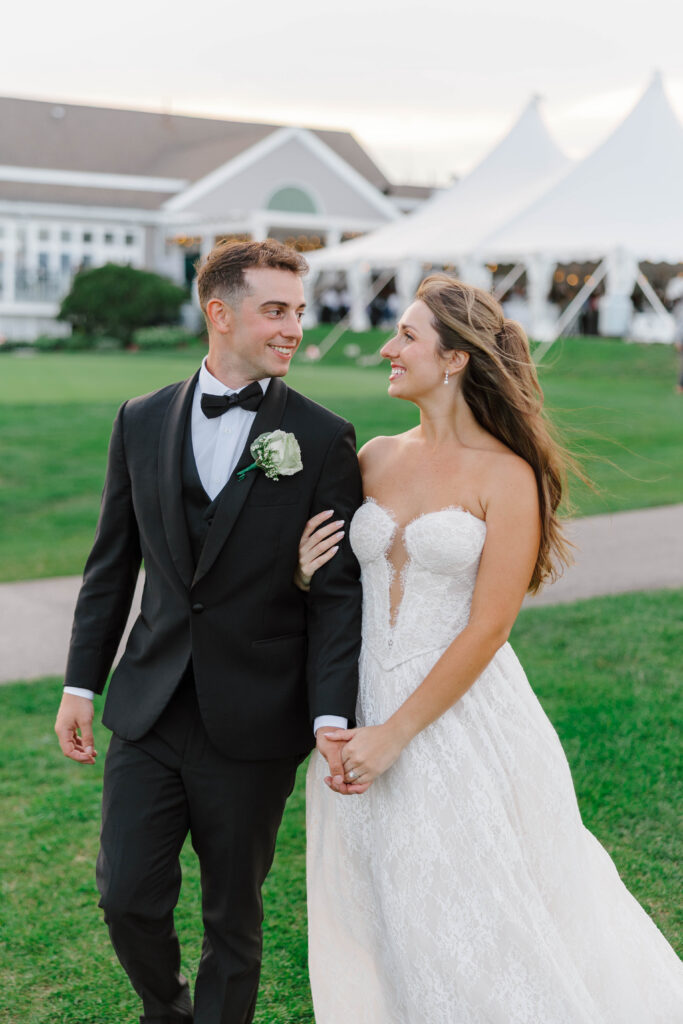 bride and groom portrait with tent in the background at the white cliffs country club