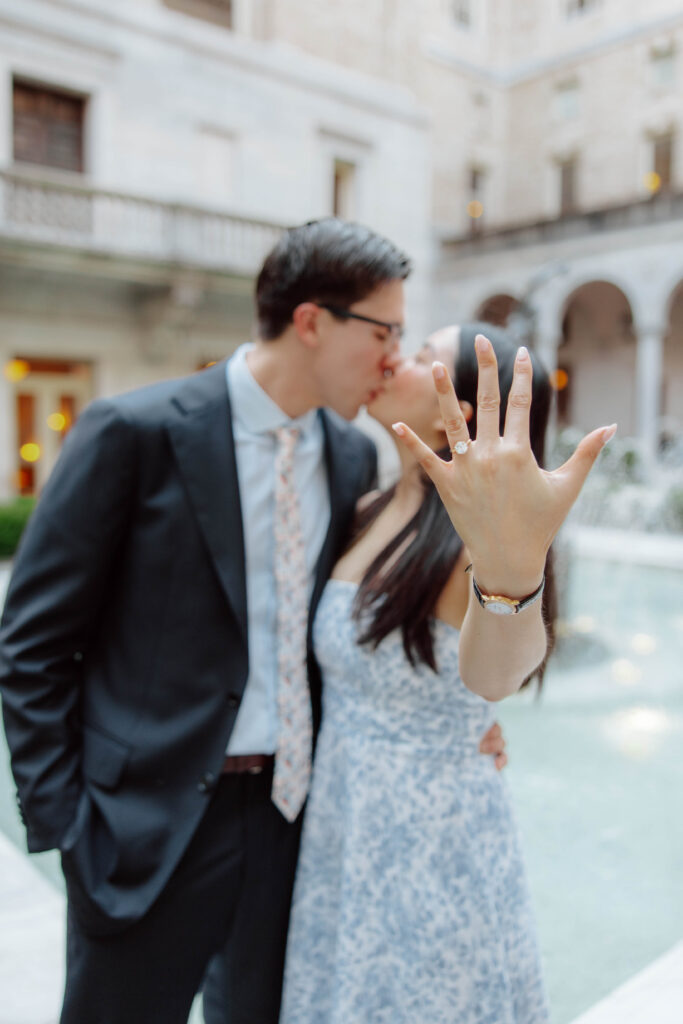 Woman shows engagement ring during proposal in Boston, Massachusetts