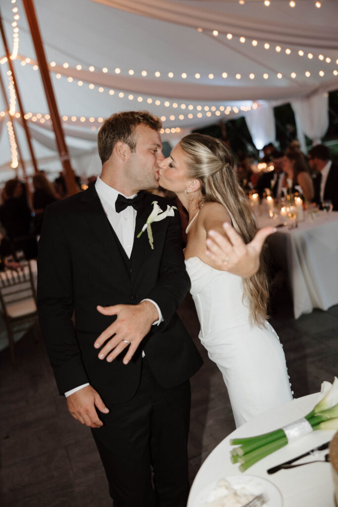 Bride and groom show off wedding rings