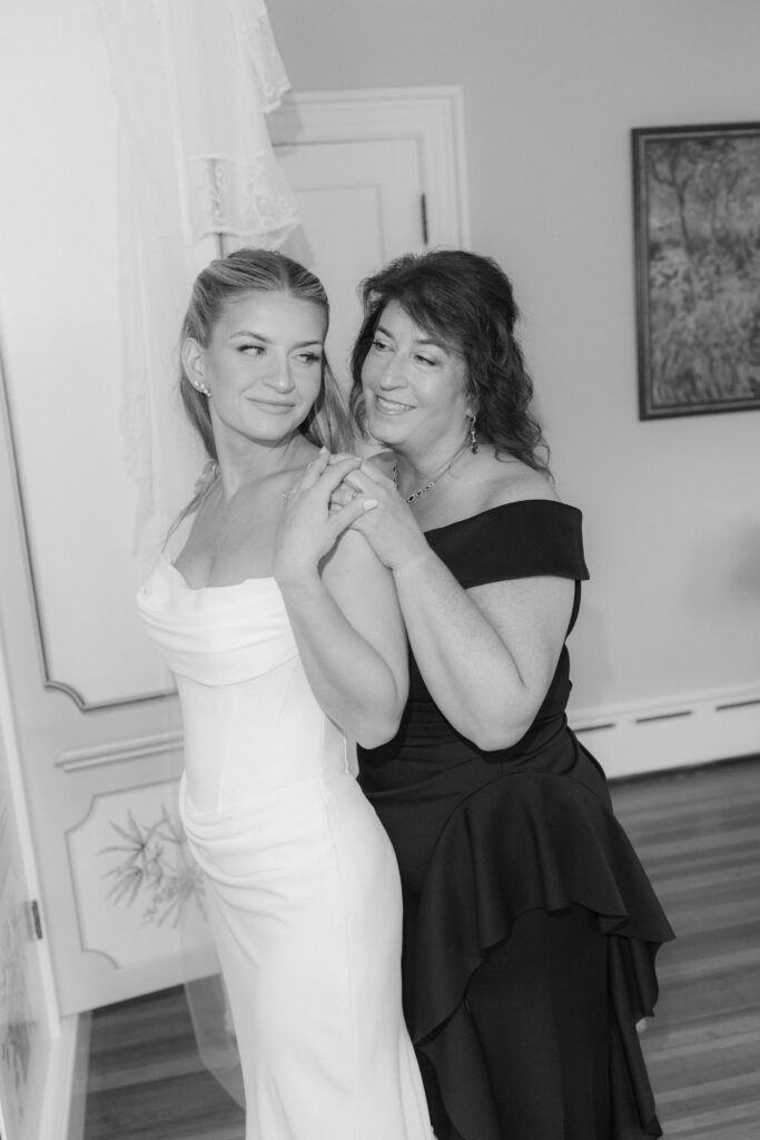 Bride and mom share a moment before wedding ceremony