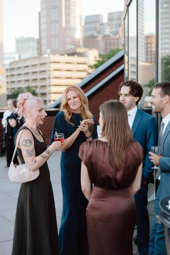 Candid photo of wedding guest at cocktail hour in Boston, Massachusetts