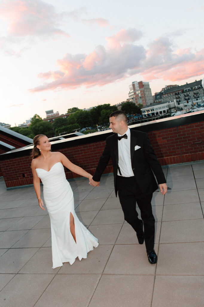 Sunset portrait of bride and groom on wedding day in downtown Boston