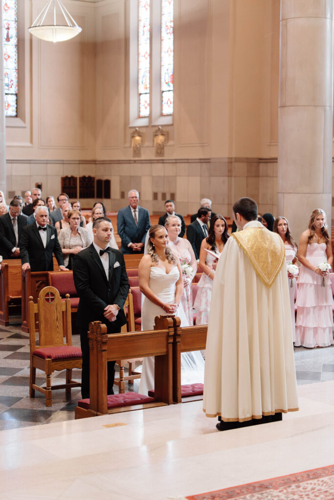 Bride and groom standing at alter at church ceremony in Boston